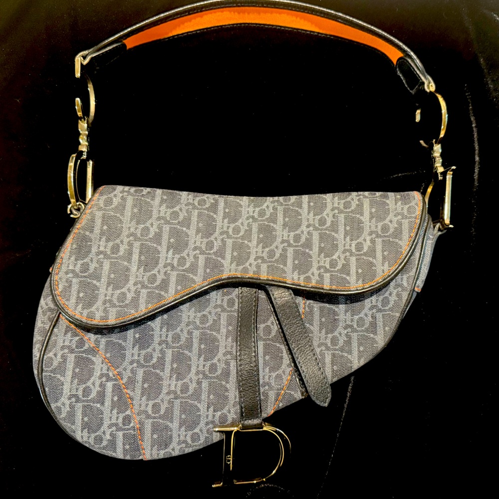 Pre-Loved Christian Dior vintage denim saddle bag with orange accents